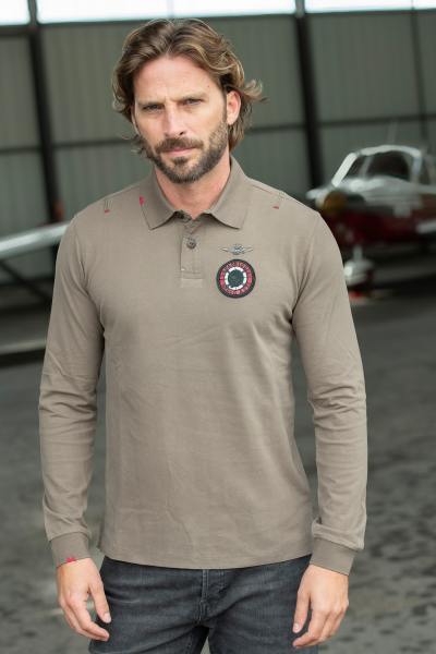 Polo manches longues en coton avec badge sur le coeur