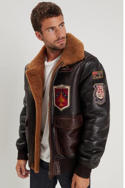 Bomber in shearling con toppe