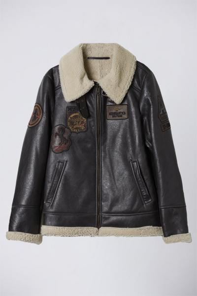 Bomber in shearling con toppe